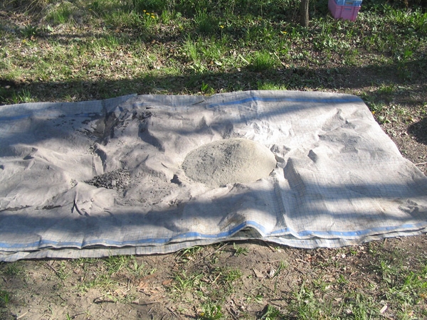 Bche tale. Un seau de sable y a t vers.